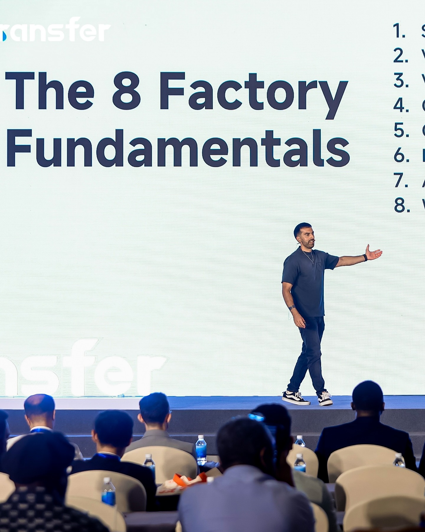 Kian Golzari on stage speaking to an audience